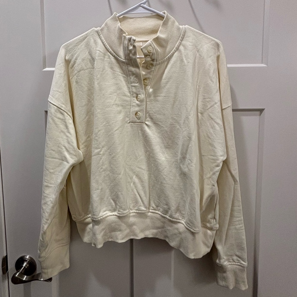Calia cream colored crew neck button up sweatshirt.